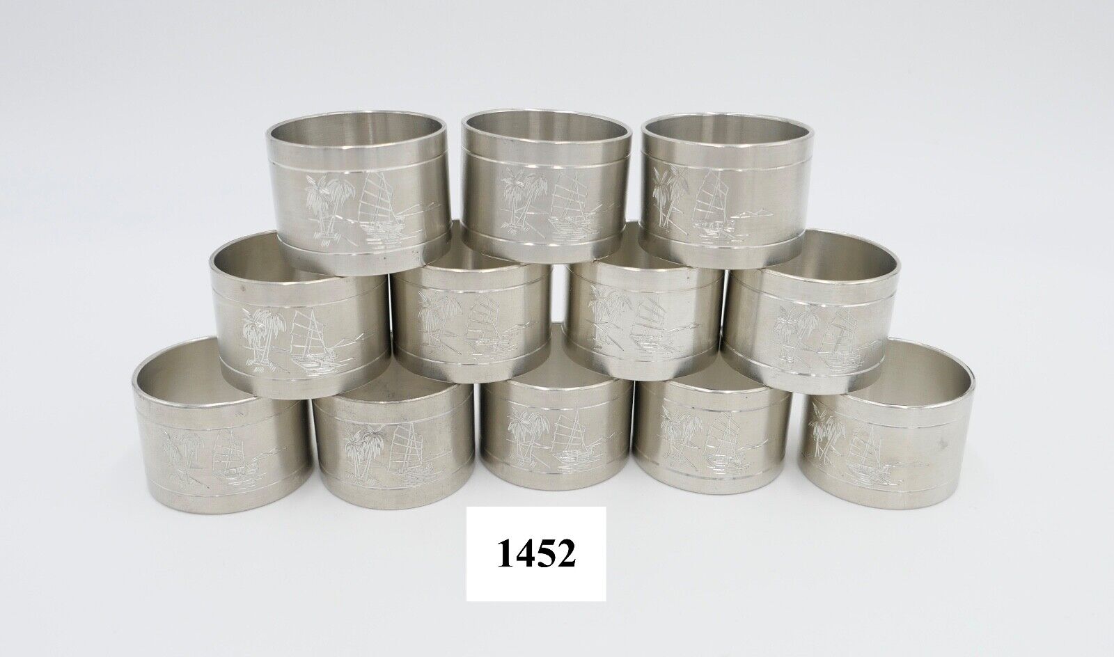 NEUwertig 12 Stück Royal SELANGOR PEWTER Zinn Tinn Serviettenringe Palmen Meer