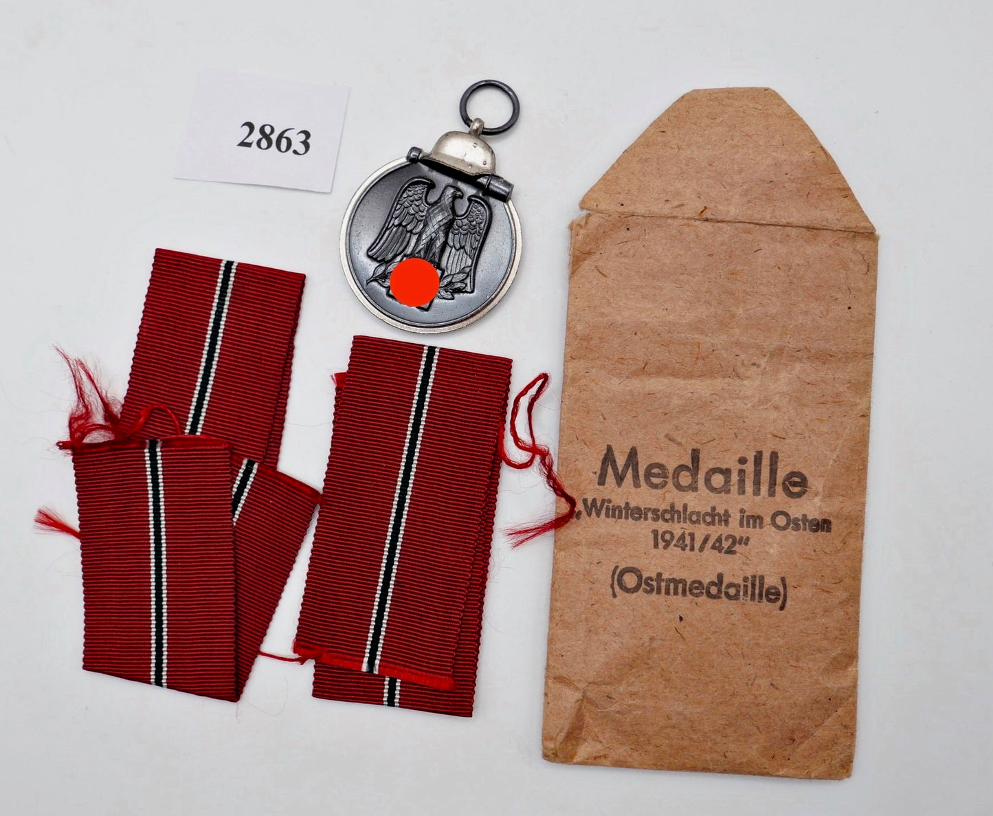 Medaille Winterschlacht im Osten 1941/42 Ostmedaille Hersteller 65 Verleihungstüte Bänder